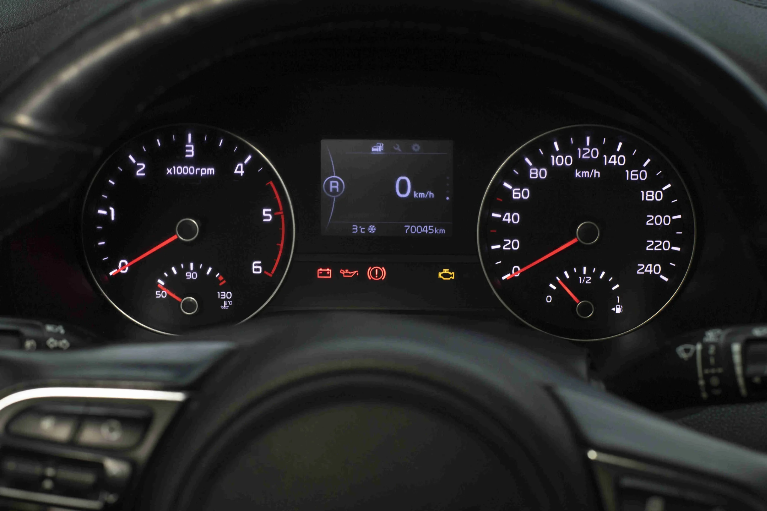 Car dashboard full of warning lights